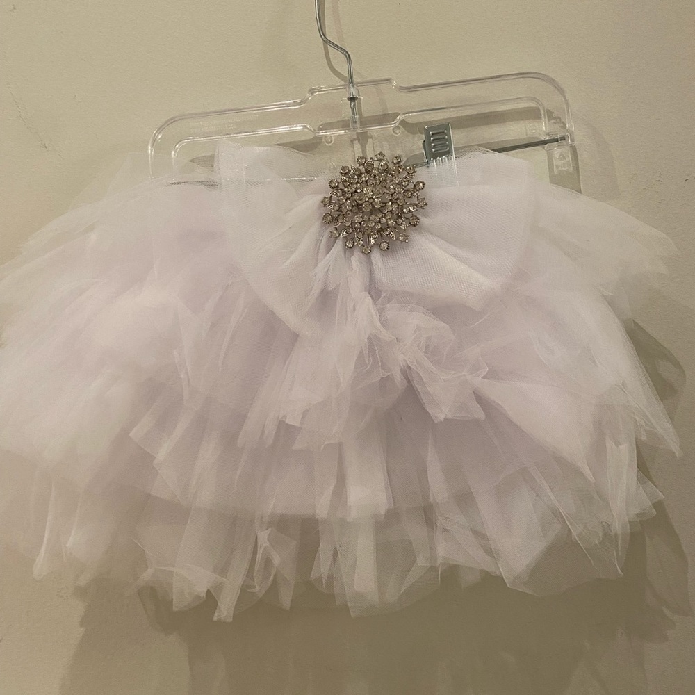 Tulle skirt with a brooch attached